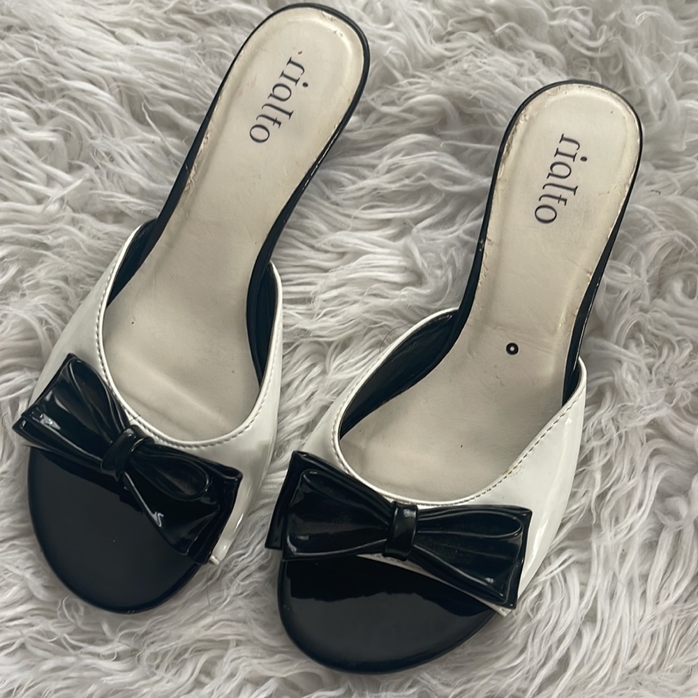 Black and white kitten Heels slip on patten with bow.